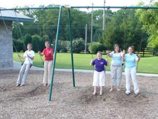 Grand Officers playing on the swings